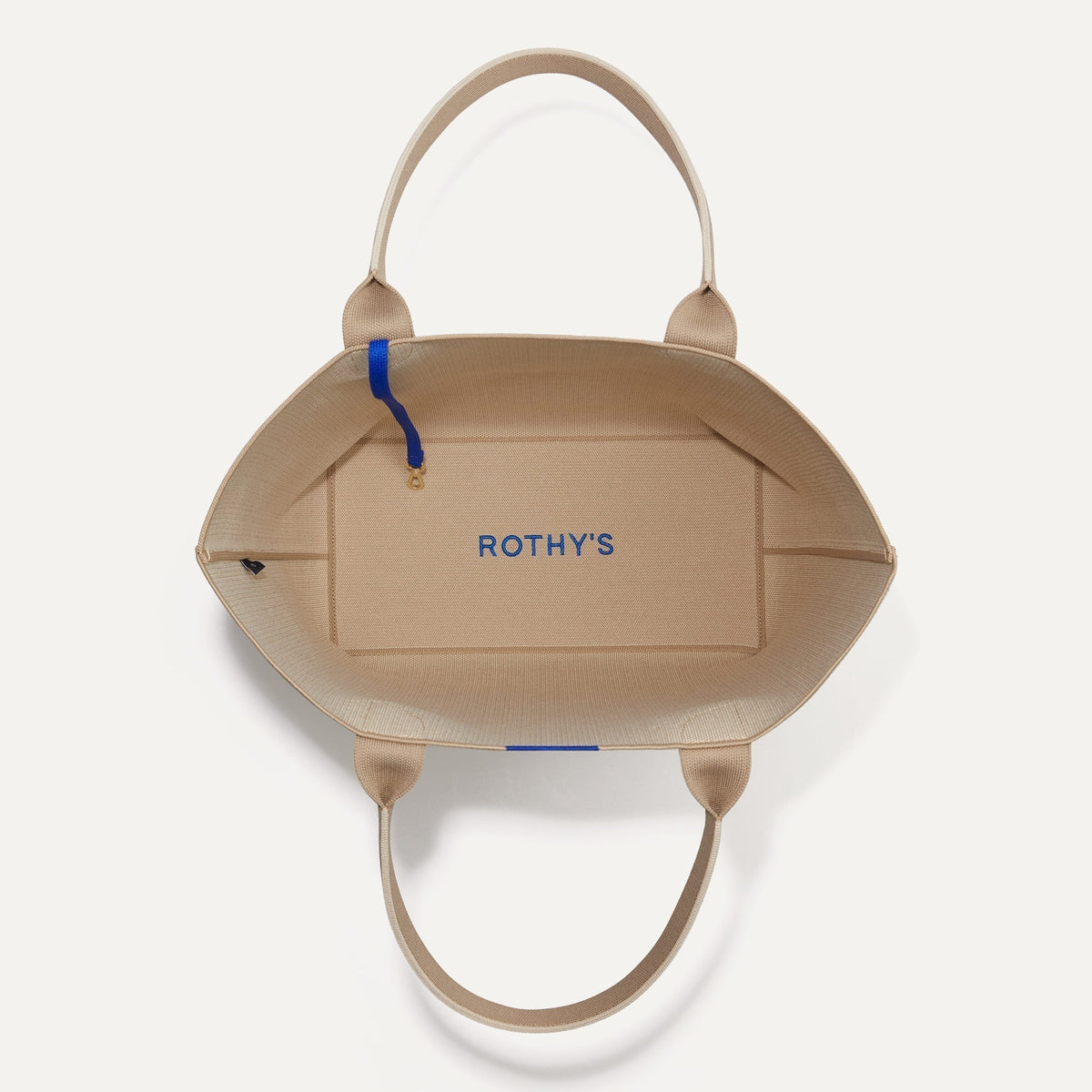 The Lightweight Tote in Soft Sesame shown open from the top, with base insert visible.