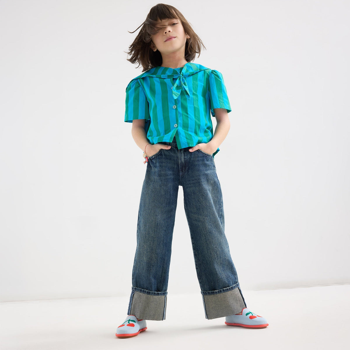 model | An alternate image of a model wearing The Mini Loafer in Cherry Blue.
