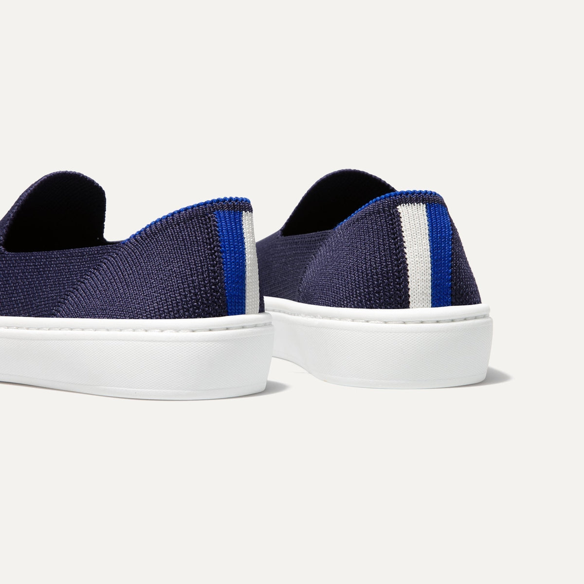 hover | The Kids slip-on Sneaker in Deep Navy shown from the back view with the heel detail.