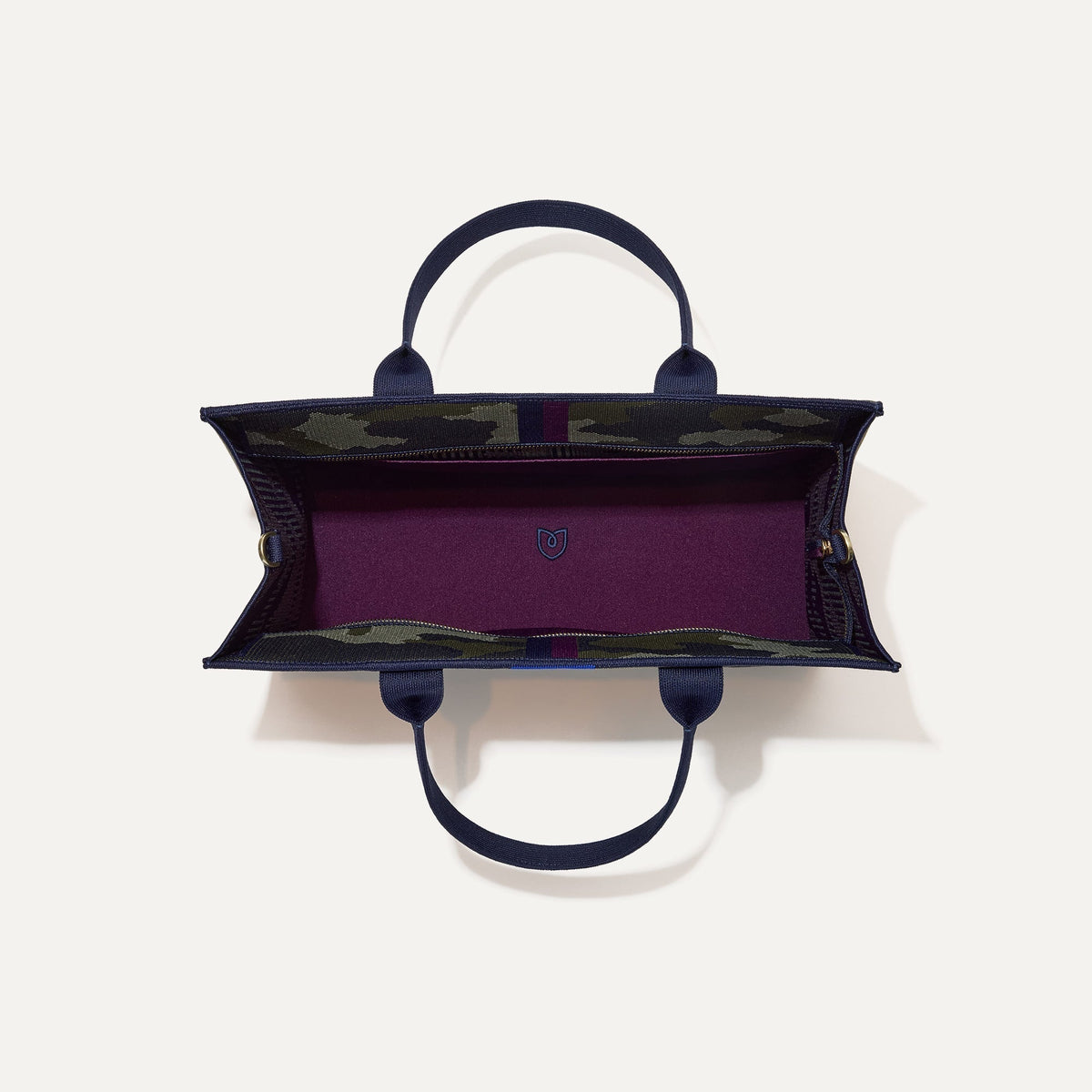 The Classic Tote in Spruce Camo, shown from above, with the interior exposed.