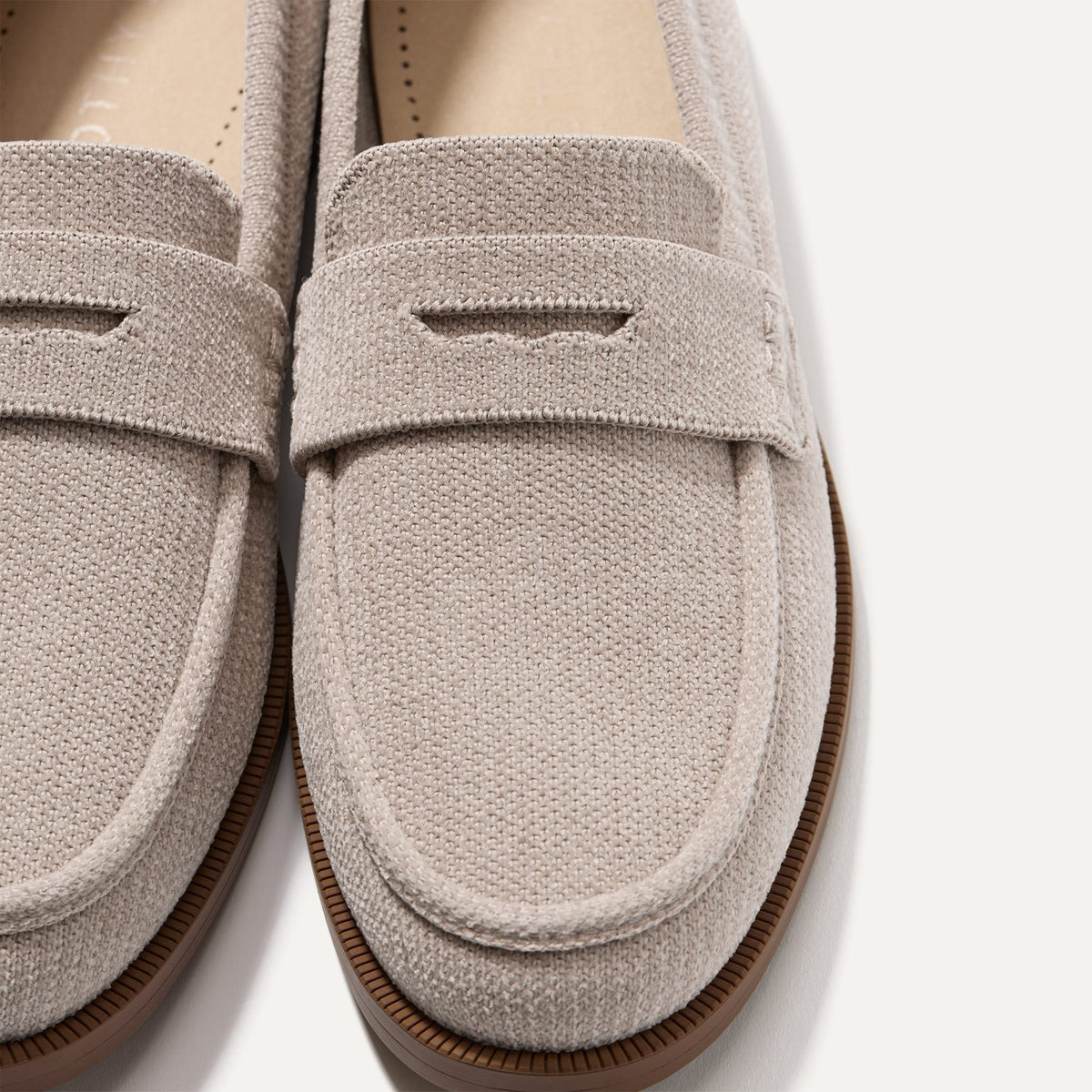 Close up of the toe box and penny keeper of The Penny Loafer in ReVelvet™ Dove.