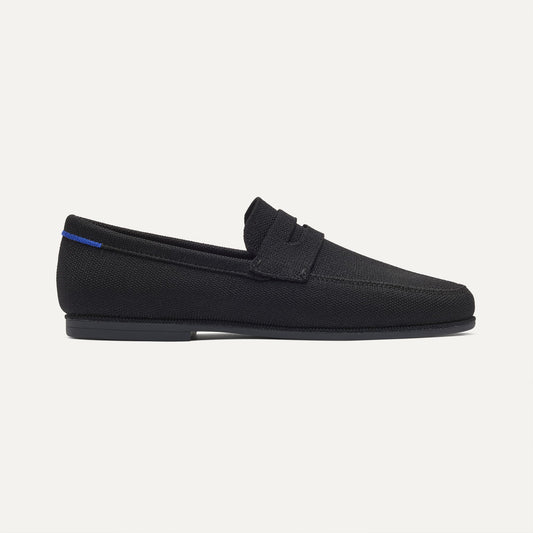 side | The Ravello Penny Loafer in Black shown from the side.