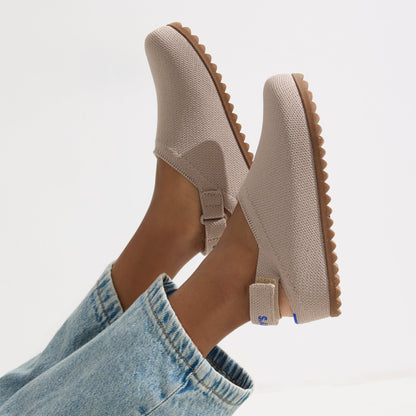 hover | A child wearing The Kids Clog in Dove.