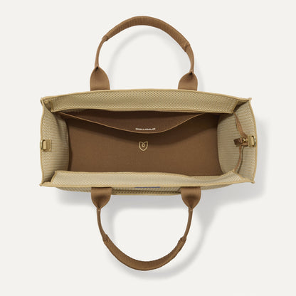 The Classic Tote in Macadamia Open-Knit, shown from above, with the interior exposed.