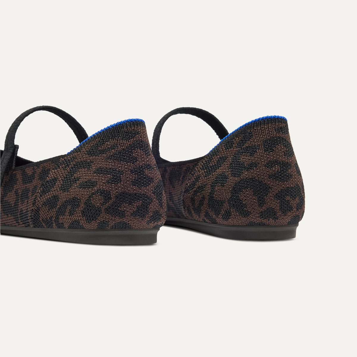 Close up of the heel of The Square Mary Jane in Classic Cheetah, with Rothy's signature blue halo.